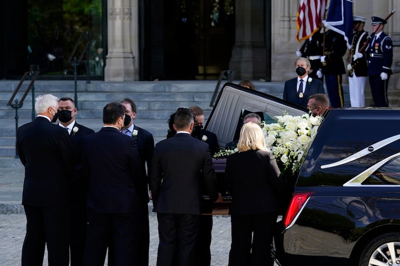 Albright’s coffin is carried into the cathedral. EPA