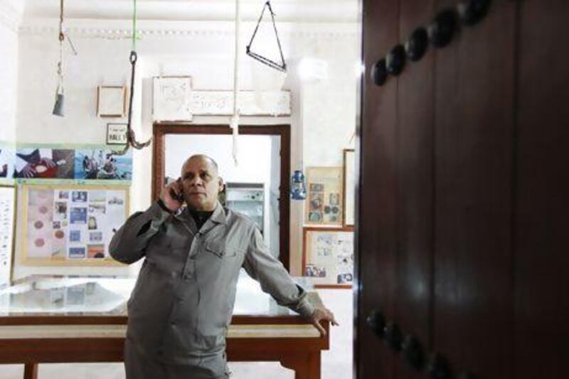 Fathy Mohammed Abdullah, an archaeologist and tour guide with Mishka Tourism, at the Dalma Museum. Sarah Dea / The National