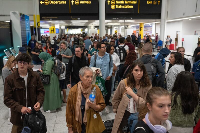 Passengers queuing at Gatwick Airport after a glitch in the air traffic control system caused mass cancellations. Getty Images.