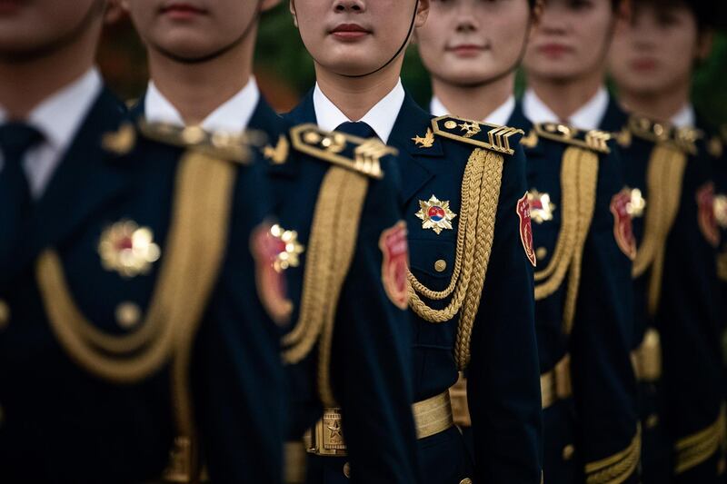 Female members of Chinese People's Liberation Army honour guard wait for the welcome ceremony for President of Botswana Mokgweetsi Masisi at the Great Hall of the People in Beijing, China. Getty Images