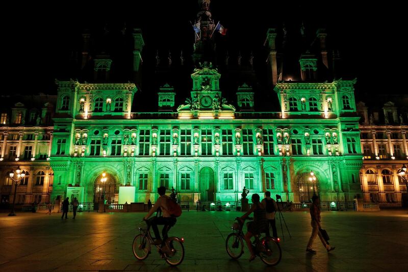 FILE PHOTO: Green lights are projected onto the facade of the Hotel de Ville in Paris, France, after U.S. President Donald Trump announced his decision that the United States will withdraw from the Paris Climate Agreement at a news conference  June 1, 2017. REUTERS/Philippe Wojazer/File Photo