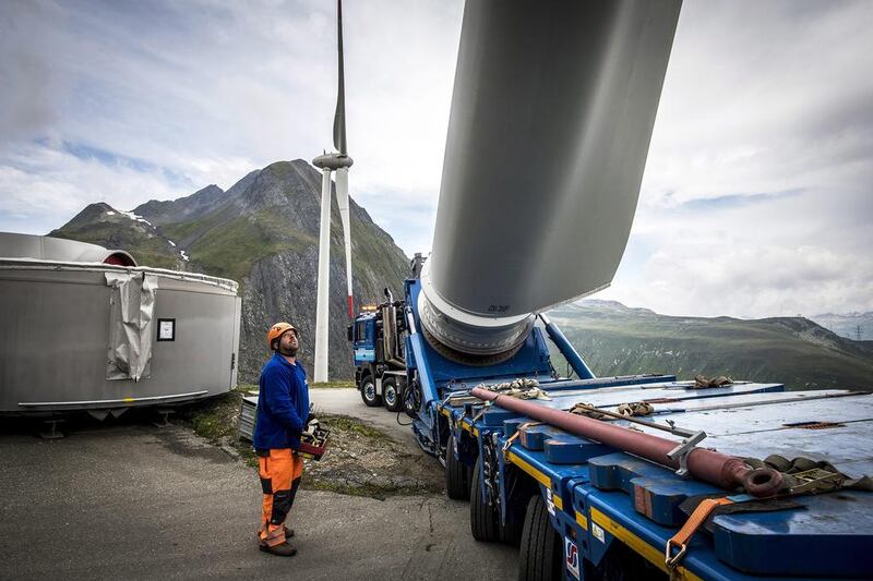 A wind turbine blade is transported on a special vehicle to Griessee lake. The wind turbines were developed by the company SwissWinds. Olivier Maire / EPA