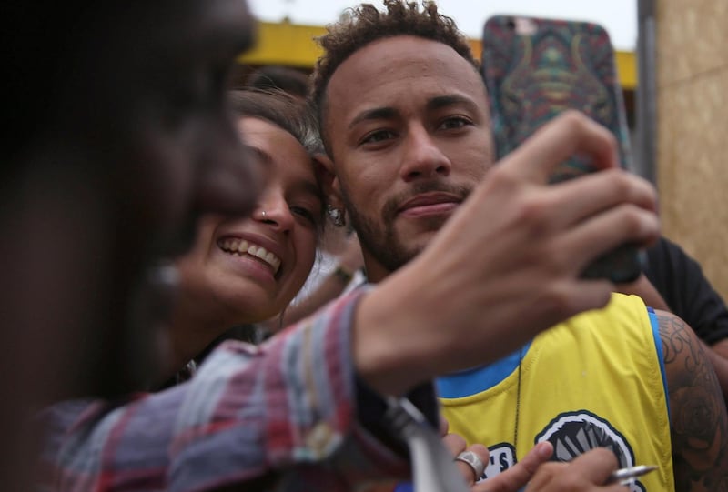 A fan takes a selfie with Soccer player Neymar in the Neymar Jr's Five soccer tournament in Santos, state of Sao Paulo, Brazil July 21, 2018. REUTERS/Amanda Perobelli