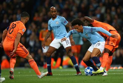 Manchester City's Leroy Sane vies for the ball with Lyon's Marcelo during the Champions League Group F soccer match between Manchester City and Lyon at the Etihad stadium in Manchester, England, Wednesday, Sept. 19, 2018. (AP Photo/Dave Thompson)