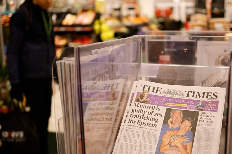 A headline from 'The Times' in a London store on December 30, 2021, the morning after a jury in New York found Maxwell guilty of recruiting and grooming young girls to be sexually abused by Epstein. AFP