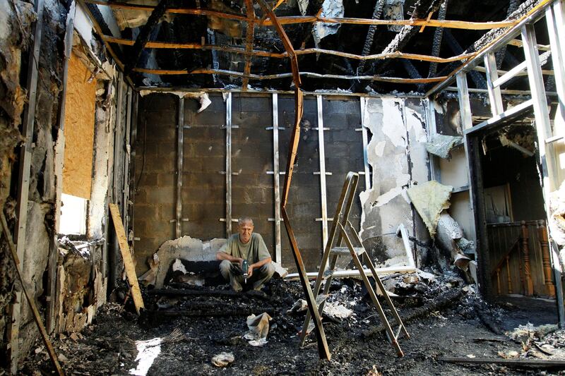 A local resident sits in his house, which was damaged by a recent shelling, in the rebel-controlled city of Donetsk, Ukraine July 18, 2017. REUTERS/Alexander Ermochenko     TPX IMAGES OF THE DAY