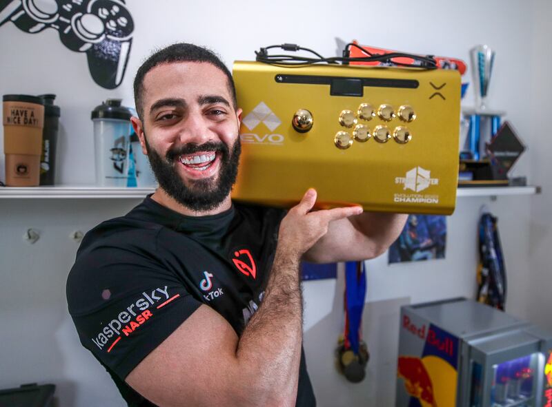 Amjad 'AngryBird' Al Shalabi received a gold-plated arcade joystick for his win at Evo 2023. All Photos: Victor Besa / The National 