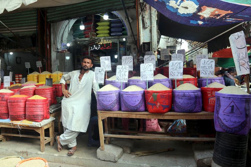 A vendor waits for customers in Karachi. With 220 million people, a nuclear stockpile and a fragile democracy, there is likely to always be some sensitivity to what a default in Pakistan may cost the world. EPA