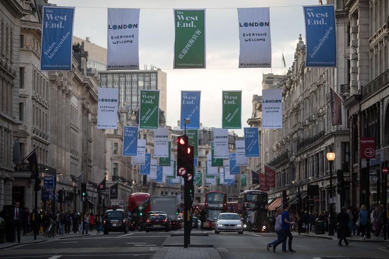 Banners advertising London's 'West End' shopping district hang above shoppers along Regent Street in central London, U.K., on Thursday, Aug. 31, 2017. U.K. consumer confidence staged a slight rebound from its lowest level since just after the Brexit vote. Photographer: Simon Dawson/Bloomberg