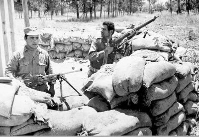 Picture dated 26 July 1974 shows Greek-Cypriot soldiers guarding a position near Nicosia, some 11 days after a coup d'Etat organised by Greek-Cypriots took place. The coup prompted Turkey to invade the northern part of the island and Cyprus has been divided for the ensuing years. Cyprus President Glafcos Clerides and Turkish leader Rauf Denktash are scheduled to meet for UN-sponsored discussions on the Cyprus problem, 09 July in New York, for the first time in three years. (Photo by HO / AFP)