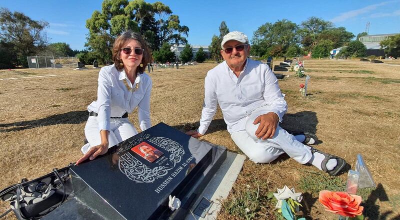 Janna Ezat and Hazim Al-Umari at her son Hussein Al-Umari's grave. Courtesy Janna Ezat