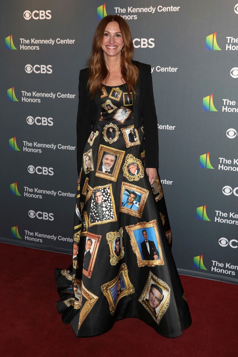 Julia Roberts arrives at the Kennedy Centre Honours in December 2022 wearing a custom Moschino gown covered with pictures of George Clooney's face. AP