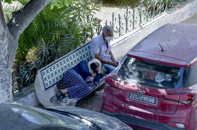 Covid-19 patients wait outside for admission to the Charles Nicolle hospital's emergency room in Tunis, the Tunisian capital, on July 16, 2021. AFP