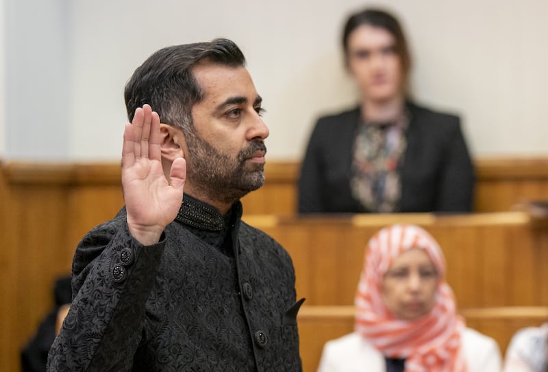 Humza Yousaf takes the oath as he is sworn in as First Minister of Scotland at the Court of Session, Edinburgh. PA