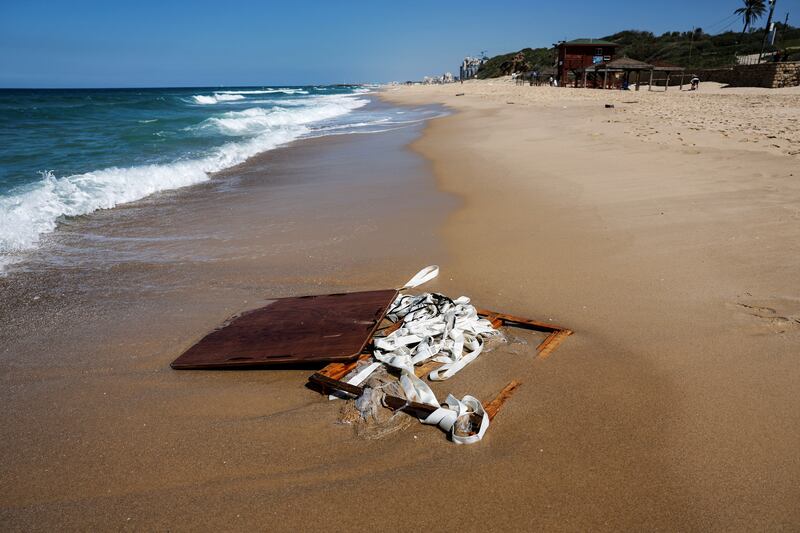 Remains of what appears to be a parachuted crate carrying aid for Gaza washed up on Israel's shore of the Mediterranean Sea, in Ashkelon. Reuters