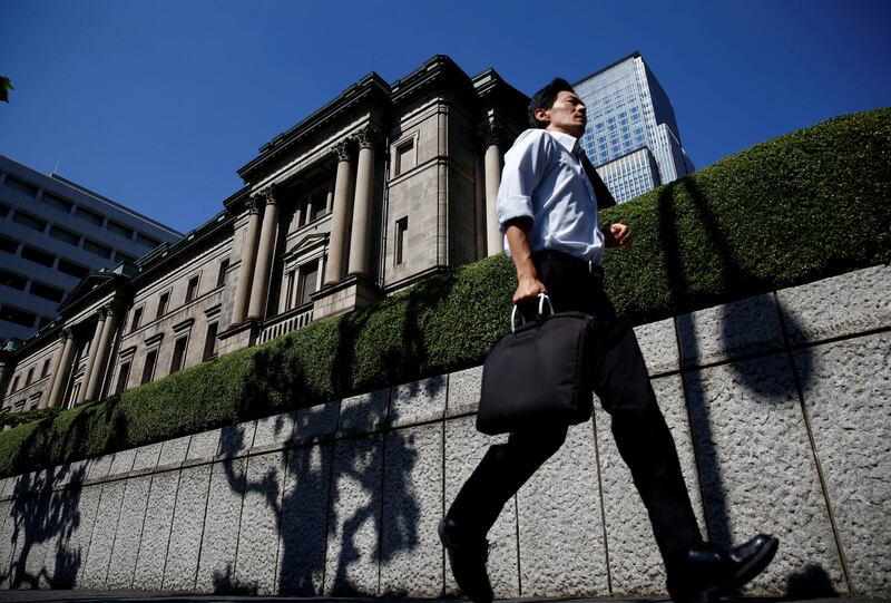 FILE PHOTO -  A man runs past the Bank of Japan (BOJ) building in Tokyo, Japan, July 29, 2016.   REUTERS/Kim Kyung-Hoon/File Photo   GLOBAL BUSINESS WEEK AHEAD     SEARCH GLOBAL BUSINESS OCT 23 FOR ALL IMAGES