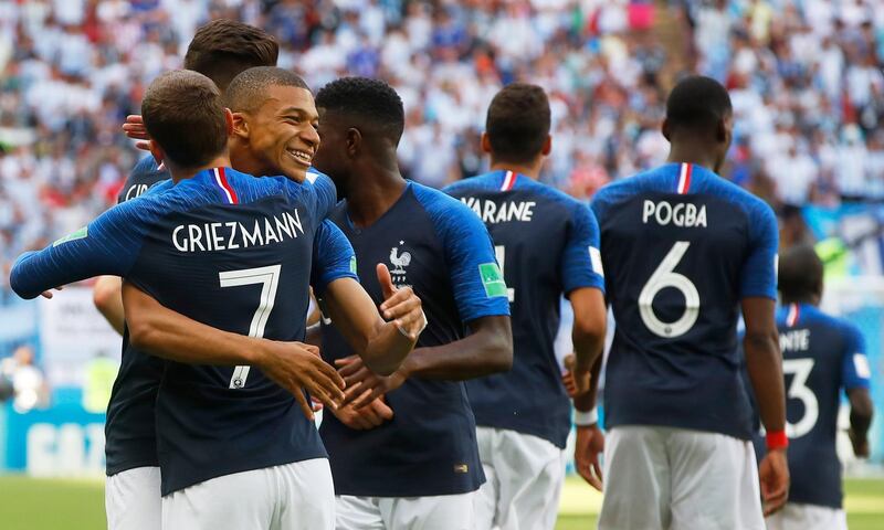 Antoine Griezmann, left, of France celebrates with teammate Kylian Mbappe after scoring the 1-0 lead from the penalty spot. Diego Azubel / EPA