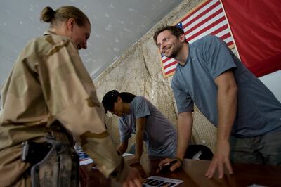 Actor Bradley Cooper signs autographs for service members at Bagram Air Base Afghanistan, on July 14, 2009. Photo by Chad J. McNeeley








