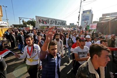 Iraqi anti-government protesters are pictured at Tahrir square on November 19, 2019. Protests erupted in early October in fury over corruption, a lack of jobs and an out-of-touch political class. / AFP / SABAH ARAR
