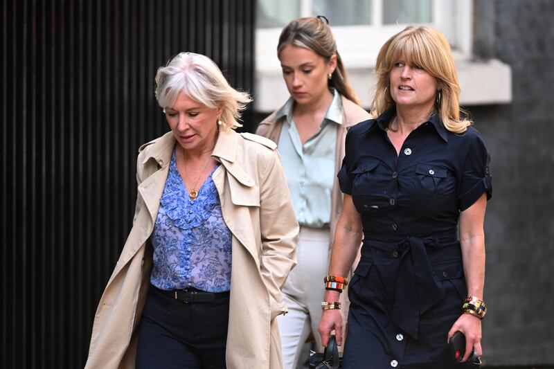 Ms Dorries, left, and Mr Johnson's sister Rachel, right, arrive at Downing Street before the prime minister's departure. Getty