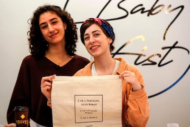 Palestinian fashion designer Yasmeen Mjalli, left, and her creative director Amira Khader. AFP 