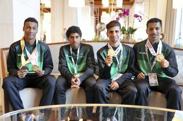 From left, Mohammed Al Olayan, Abdullah Al Jabr, Moayad Al Darwish and Mohammed Al Refai, athletes from the Saudi Special Olympics relay team Pawan Singh / The National