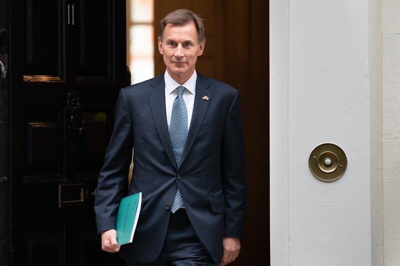 Jeremy Hunt leaving 11 Downing Street for the House of Commons to deliver his autumn statement. PA