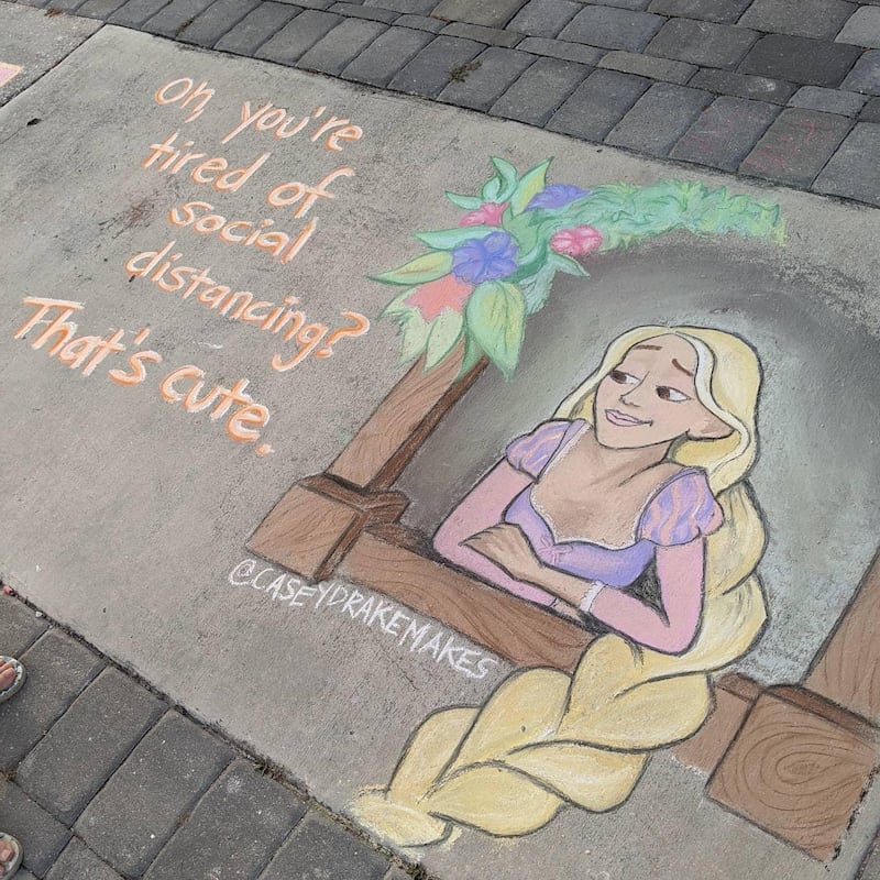 Casey Drake reimagines fairty tale characters like Rapunzel in her sidewalk artworks to comment on the coronavirus pandemic. Casey Drake