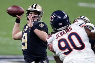 New Orleans Saints quarterback Drew Brees (9) passes under pressure from Chicago Bears defensive tackle John Jenkins (90) in the second half of an NFL wild-card playoff football game in New Orleans, Sunday, Jan. 10, 2021. (AP Photo/Butch Dill)