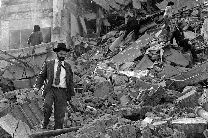 A man walks over the rubble after a bomb exploded at a Jewish community centre in Buenos Aires, Argentina, on July 18, 1994. AFP