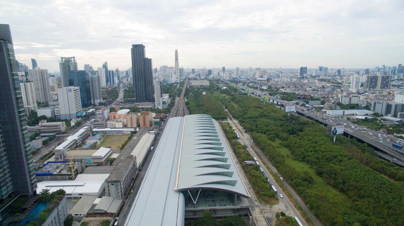 FBKK82 A aerial view of Makkasan airport rail link station Bangkok, Thailand looking east.