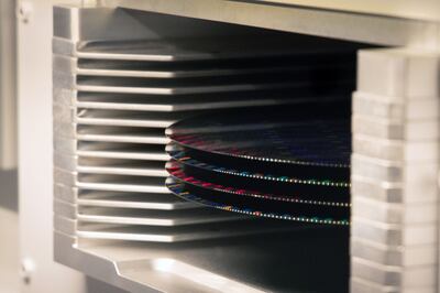 A rack of 300mm silicon semiconductor wafers inside a sorting machine at the Globalfoundries Inc semiconductor fabrication plant in Dresden, Germany.  Bloomberg