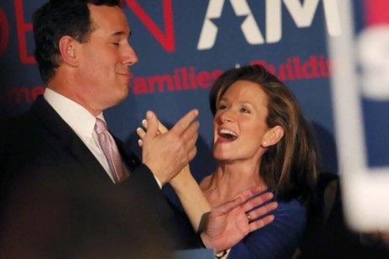 Rick Santorum celebrates with his wife, Karen, after clinching the Alabama and Mississippi primaries.