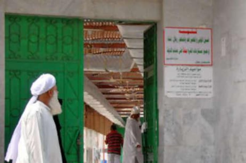 The green metal door of the 'The graveyard of our mother Eve' in Jeddah.