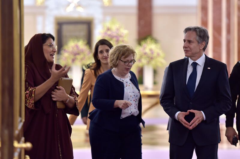 Saudi ambassador to the US Reema Bint Bandar, left, talks to Mr Blinken in Jeddah. AP