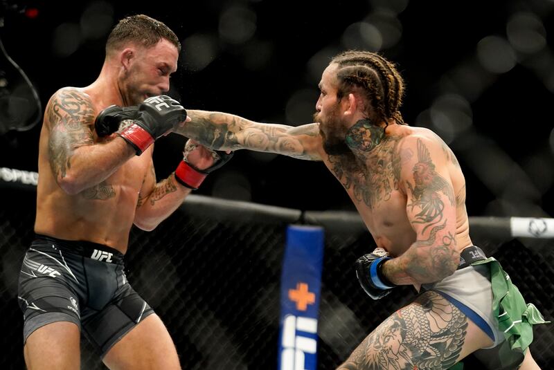 Marlon Vera, right, lands a punch against Frankie Edgar. AP Photo