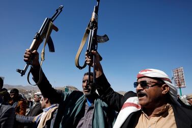 Houthis-allied tribesmen holding up weapons shout slogans during a rally against the US terrorist designation of the Houthis, in Sanaa, Yemen,  February 4, 2021. EPA