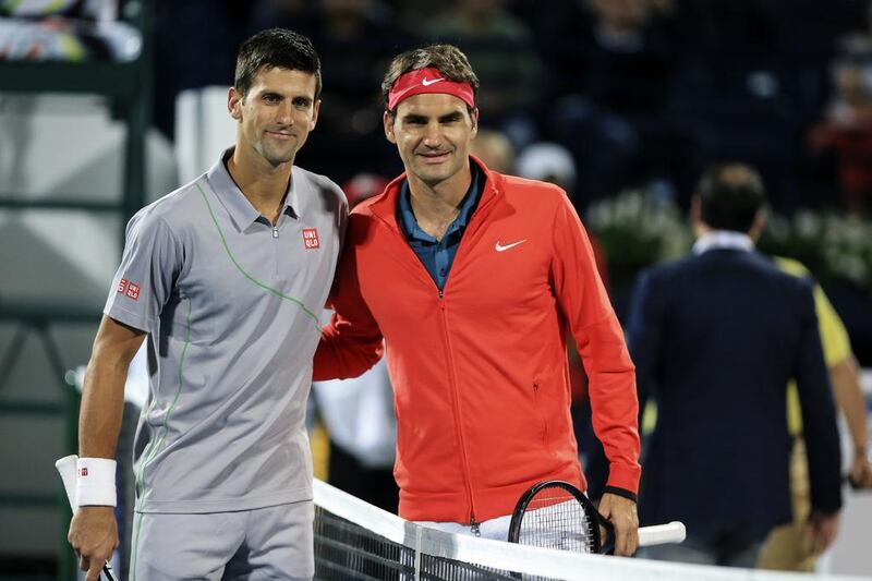 Novak Djokovic, left, and Roger Federer pose before their semi-final at the Dubai Duty Free Tennis Championships at Dubai Tennis Stadium on February 28, 2014. Sarah Dea / The National