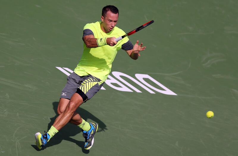 Philipp Kohlschreiber of Germany returns the ball to Gleb Sakharov of France during the Dubai Duty Free Tennis Championship in Dubai, United Arab Emirates, Saturday, Feb. 24, 2018. (AP Photo/Kamran Jebreili)