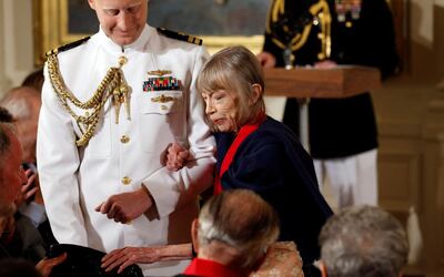 Joan Didion is escorted to her seat after then-president Barack Obama awarded her the 2012 National Humanities Medal during a ceremony at the White House in Washington in 2013.  Reuters 