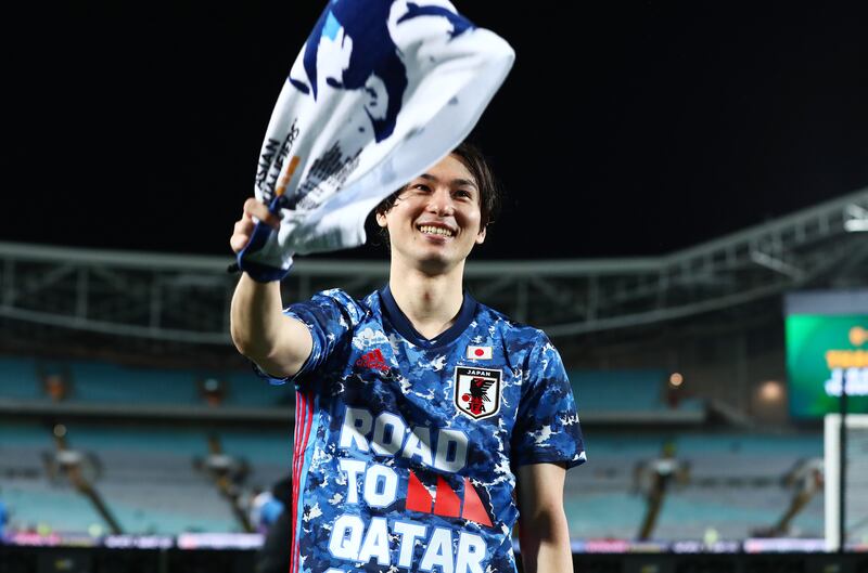 Takumi Minamino of Japan celebrates after the match. Getty