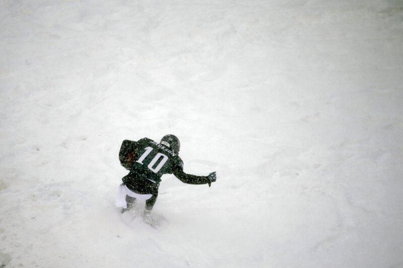 The Eagles' DeSean Jackson stands in the snow after scoring a touchdown in Philadelphia. Matt Rourke / AP