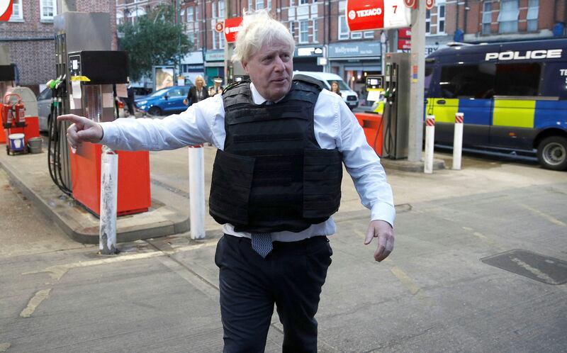 Mr Johnson on the scene following a drugs-related raid by Metropolitan Police officers in West Norwood, London. AP