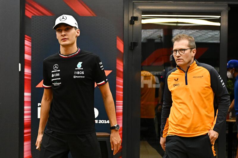 George Russell of Mercedes and McLaren team principal Andreas Seidl leave a meeting attended by all of the drivers, team principals, Stefano Domenicali, CEO of the Formula One Group and Ross Brawn, managing director. Getty
