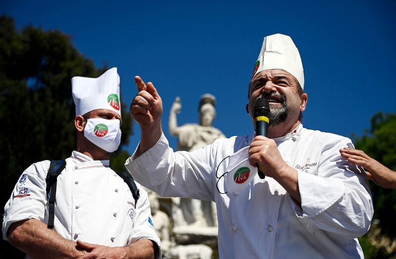 Cooks on stage during a demonstration by restaurateurs and small-business owners in Piazza del Popolo, Rome, Italy. EPA