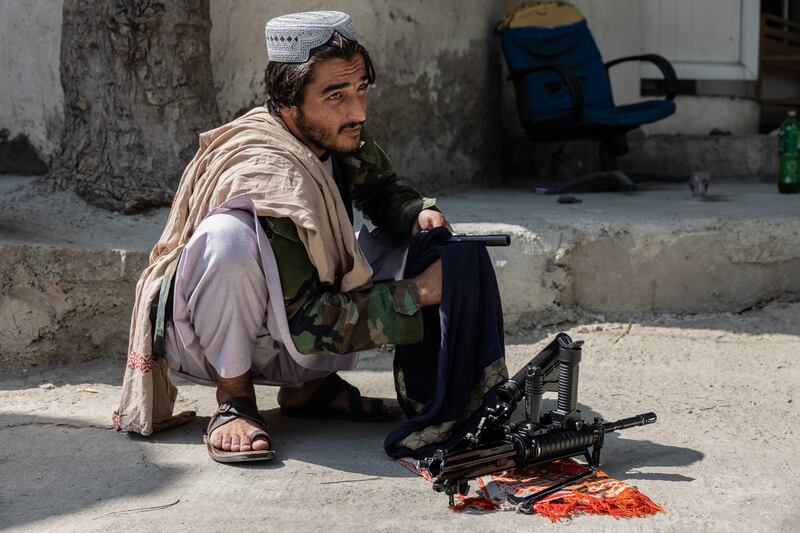 A Taliban member cleans his weapons in Kabul. Stefanie Glinski / The National