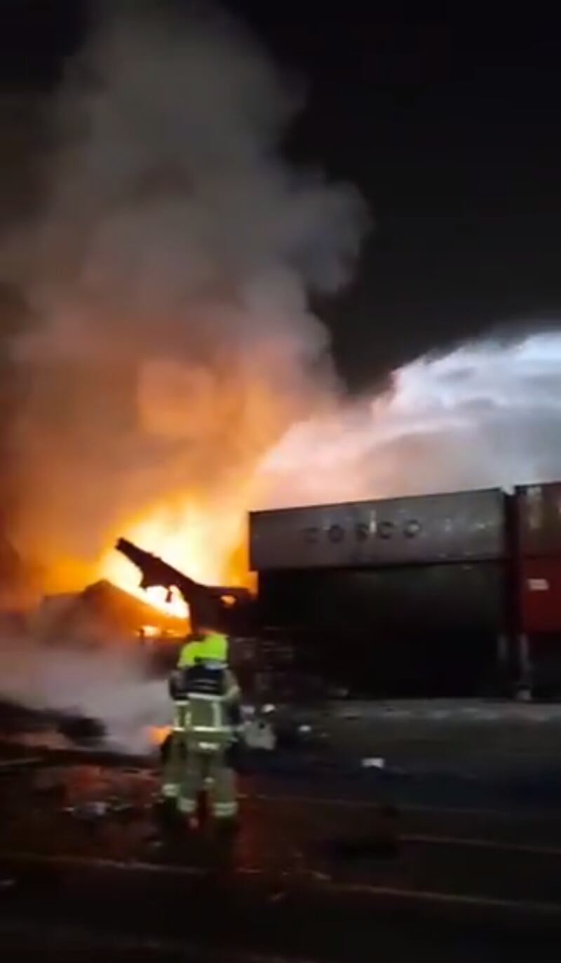 In a Dubai Civil Defence video, flames and smoke are seen pouring from the damaged vessel, which is right by the dock.