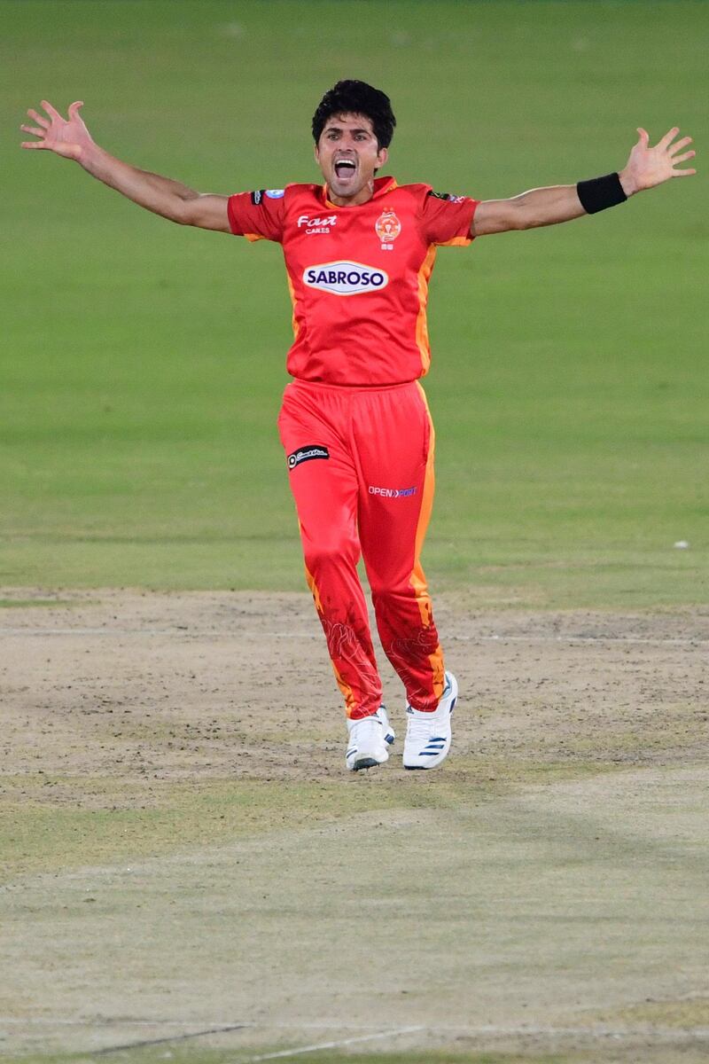 Islamabad United's Mohammad Wasim celebrates his successful appeal for LBW against unseen Peshawar Zalmi's Kamran Akmal during the Pakistan Super League (PSL) T20 cricket match between Islamabad United and Peshawar Zalmi at the National Stadium in Karachi on February 27, 2021. (Photo by Asif HASSAN / AFP)