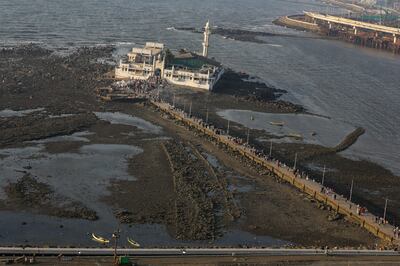 Haji Ali Dargah in Mumbai is only accessible when the tide is relatively low via a 200m-long footbridge. EPA