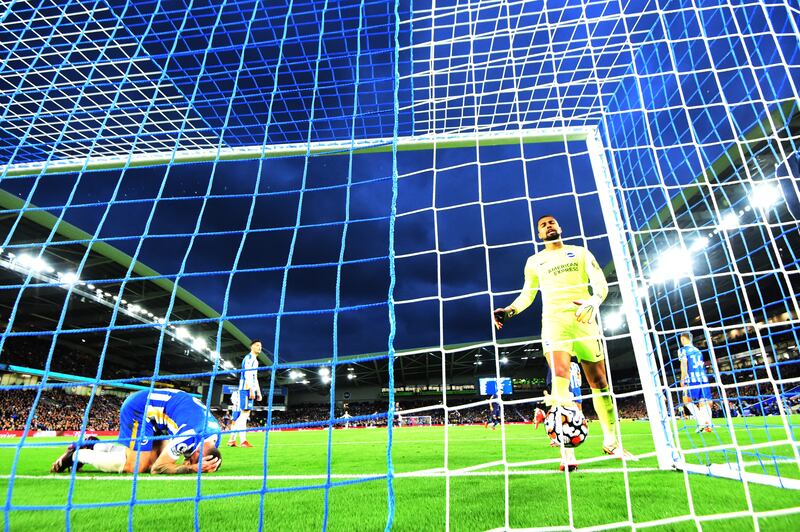 Brighton & Hove Albion's Lewis Dunk and Robert Sanchez look dejected after Manchester City's Phil Foden scored their third goal. Reuters